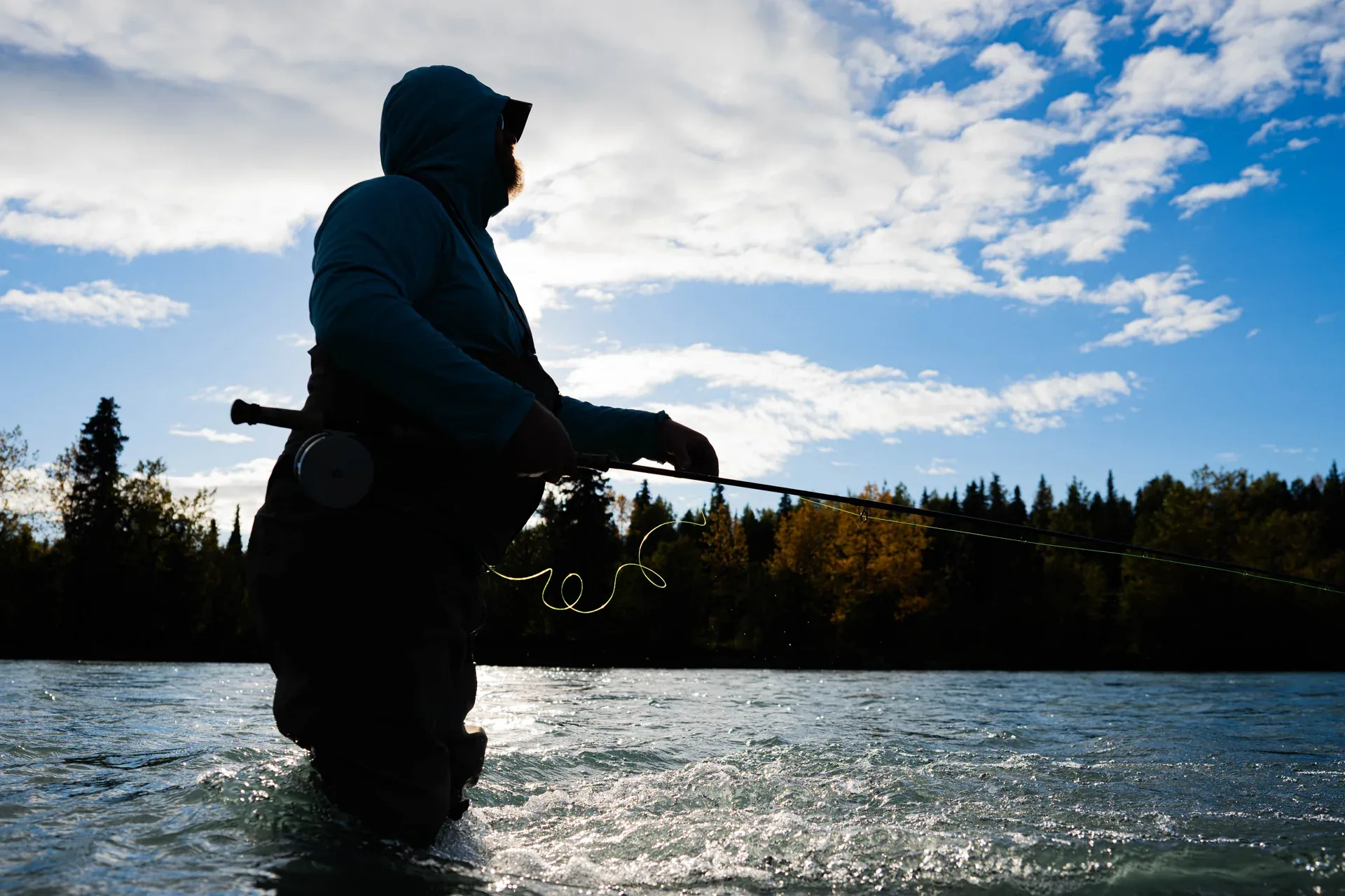Angler holding a bright Kenai Peninsula steelhead, 2025 season